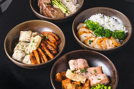 cooked food on black ceramic bowls